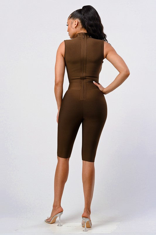 back view of model wearing Sexy Brown Criss Cross Detail Bandage Romper with clear heels