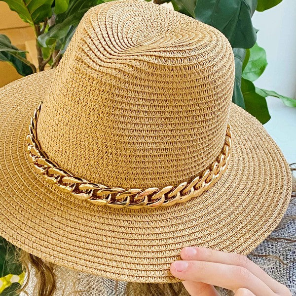 Camel color Panama hat with bold Cuban chain around brim