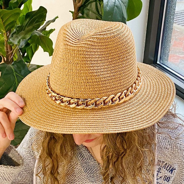 Camel color Panama hat with bold Cuban chain around brim