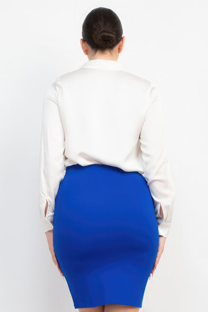 back view of model wearing off white Button-Down Pocketed Collared Top with a blue skirt