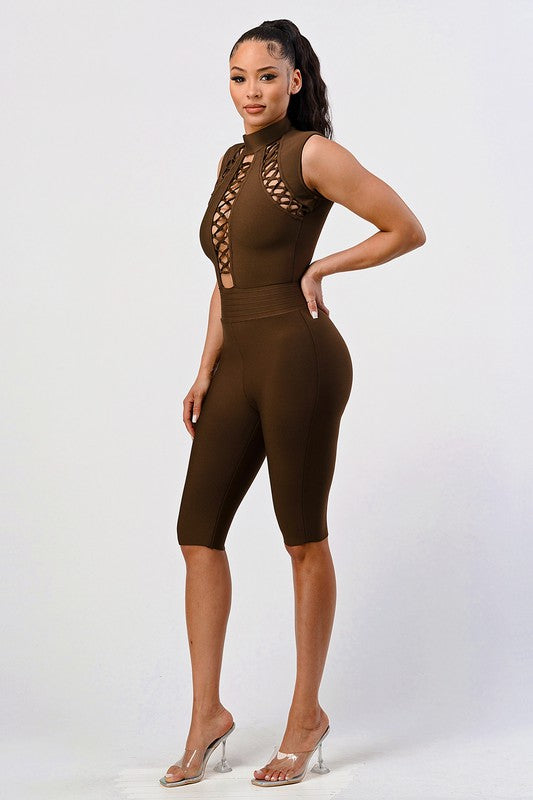 full view of Sexy Brown Criss Cross Detail Bandage Romper with clear heels