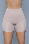 Nude high-waisted shapewear shorts with a seamless front panel for a smooth, sculpted look under clothing