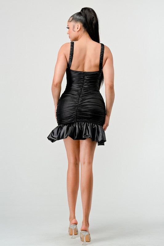 Black faux leather mini dress with ruffle hem