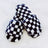 black and white Cozy Checker Lounge Slippers