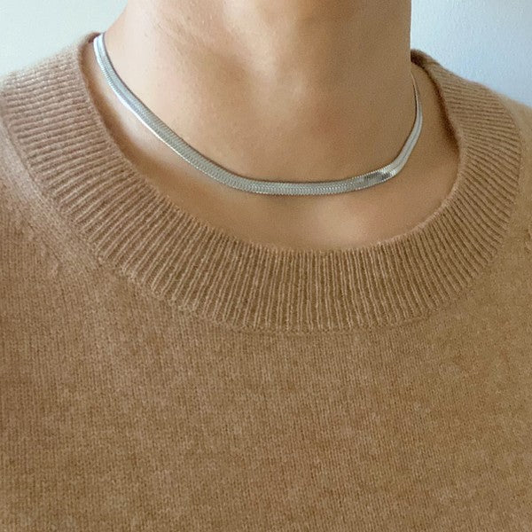 model wearing silver Herringbone Chain Necklace with a brown top
