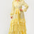 Yellow flowy tiered maxi dress with self tie waist belt