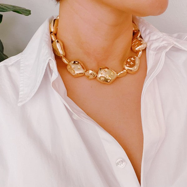 Golden Starlight Pebble Necklace shown on a model's neck