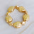 Gold pebble stretch bracelet with starlight design