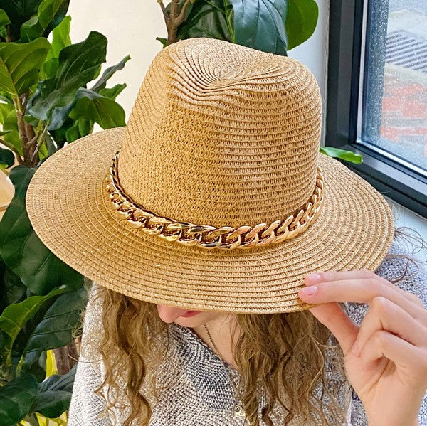 Camel color Panama hat with bold Cuban chain around brim