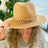 Camel color Panama hat with bold Cuban chain around brim