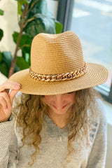 Camel color Panama hat with bold Cuban chain around brim