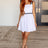 model with red hair wearing Little White Dress with Black Trim front view. divvastyle.net