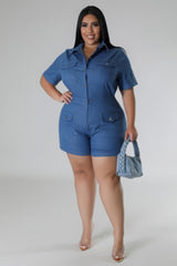 Plus Size Semi-Stretch Denim Romper full body view with model holding light blue purse