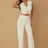 Woman wearing a white outfit with a beige background