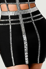 close up of bottom of Black beaded detail tube mini dress