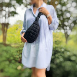 model wearing Black Quilted Puffer Sling Bag