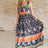 multi-color floral print maxi dress on a size small model