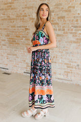 multi-color floral print maxi dress on a size small model - side view