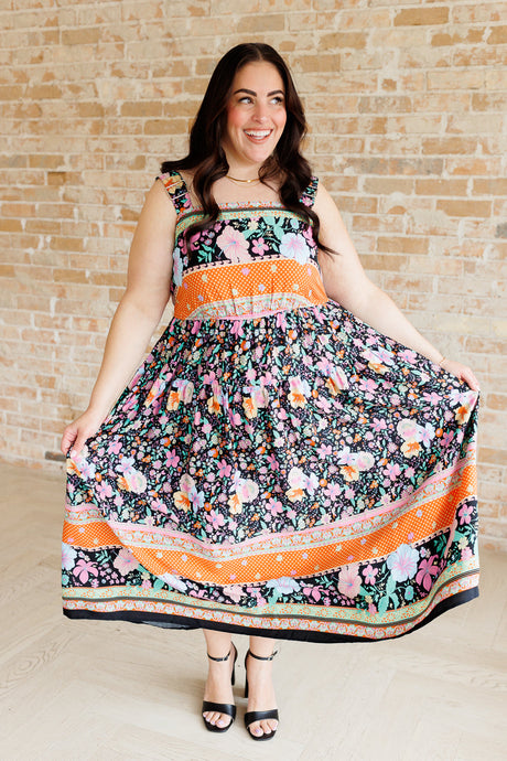 multi-color floral print maxi dress on a plus size model