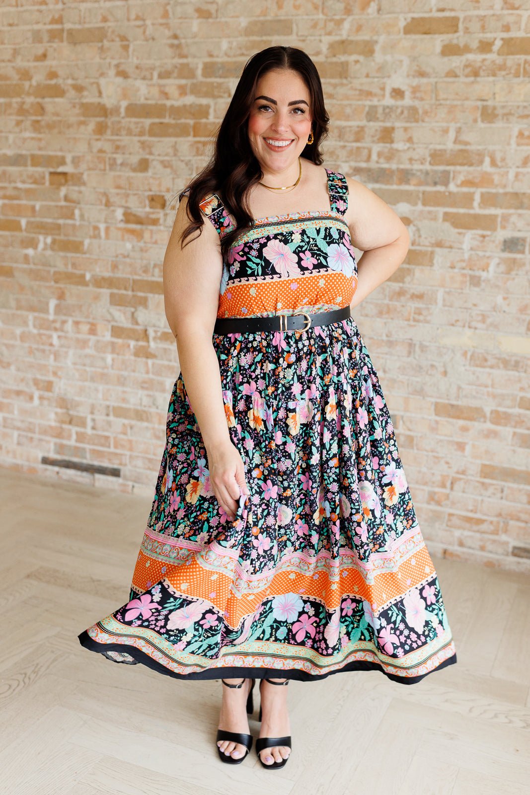 multi-color floral print maxi dress on a size plus size model styled with a belt