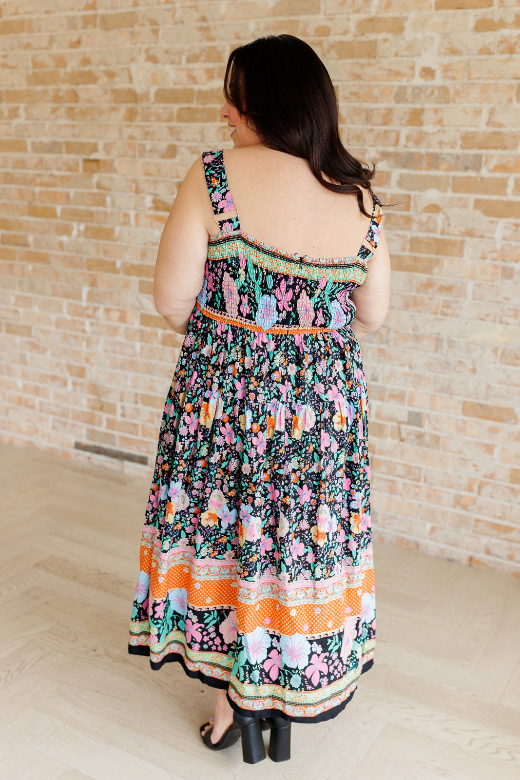 multi-color floral print maxi dress on a plus size model - back view