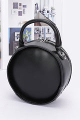 back view of black faux leather clock novelty handbag