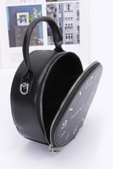 inside of black faux leather clock novelty handbag