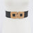Black belt with gold buckle on a white background