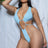 Blue one piece monokini swimsuit with a padded top, twisted racerback, deep plunging neckline, front circle strap waist detail and front skimp thong bottom