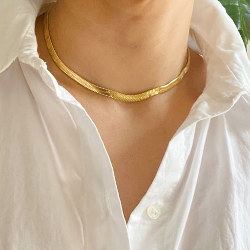 model wearing gold Herringbone Chain Necklace