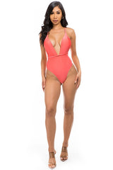 model wearing pink Low V-Neck One Piece Swimsuit