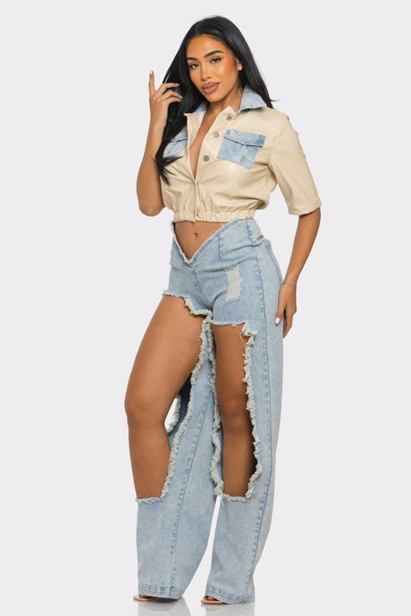 modle wearing faux leather beige top with cut out denim pants