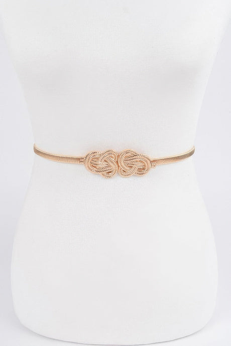 Gold belt with a knot design on a white mannequin.