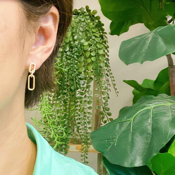 Gold Edge Dangle Earrings in model's ear