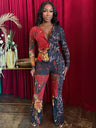 Woman in a colorful Red Leopard Bodycon Jumpsuit standing against a red curtain