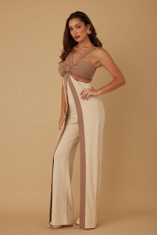 side view of a Woman wearing a beige and brown outfit on a beige background
