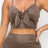 Top: A sleeveless crop top featuring an all-over embossed snake print, front tie, a sweetheart neckline, adjustable cami straps, and a square cut back.  Bottom: A pair of casual skinny leggings featuring an all-over embossed snake print, elasticized high-rise waistband, and a full length. 