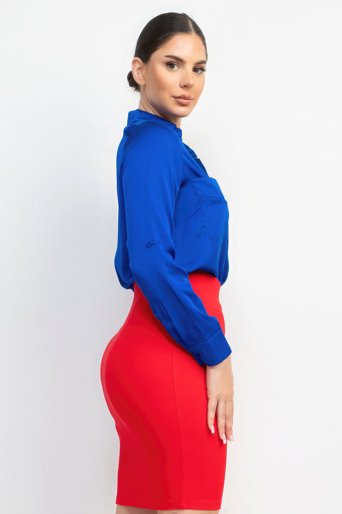 side view of model wearing royal blue Button-Down Pocketed Collared Top with an orange/red skirt