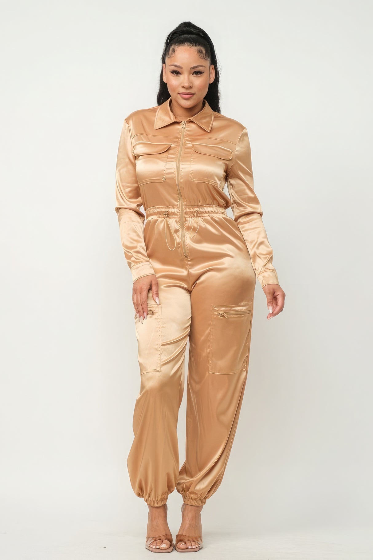 model wearing gold Zip Front Satin Cargo Jogger Jumpsuit