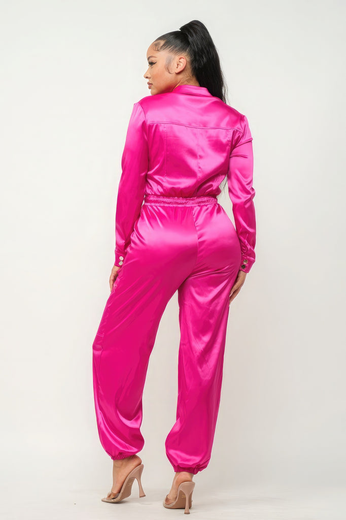 back view of model wearing pink Zip Front Satin Cargo Jogger Jumpsuit