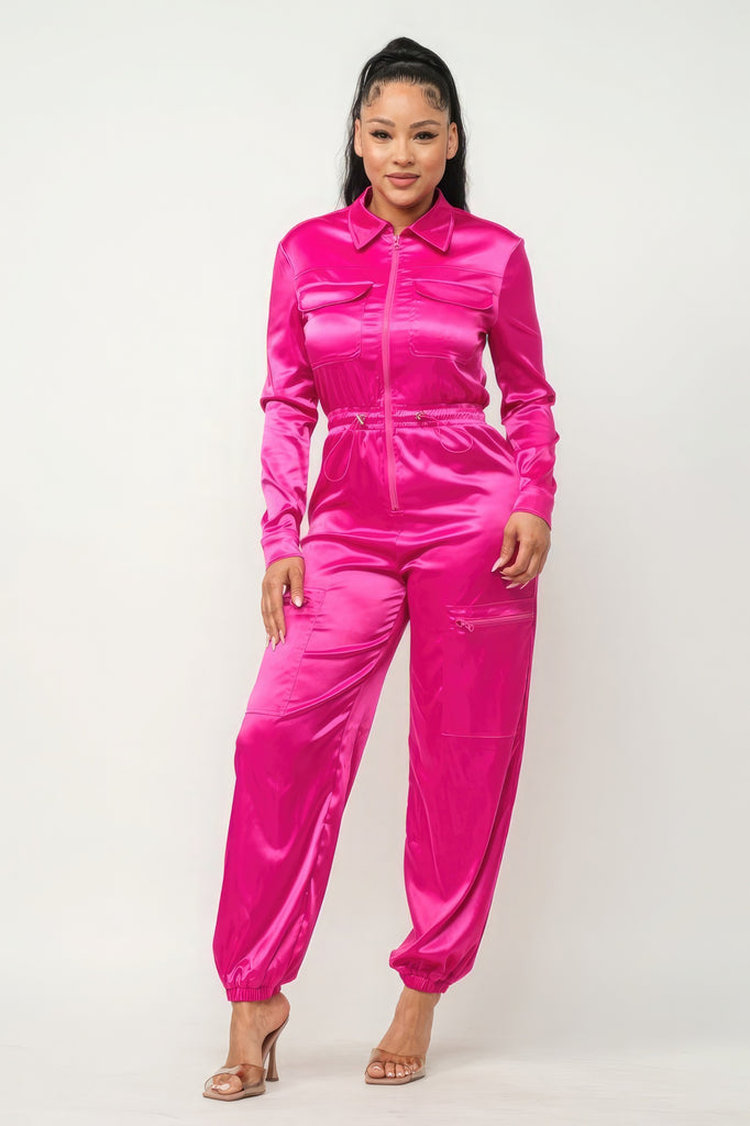model wearing pink Zip Front Satin Cargo Jogger Jumpsuit with clear heels