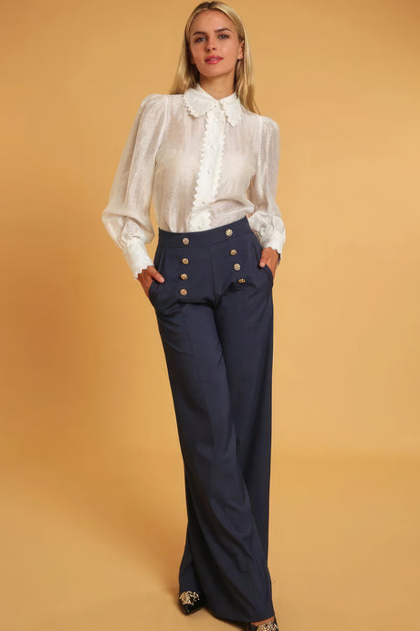 model wearing denim blue High Waisted Wide Leg Dress Pants with a white button down blouse