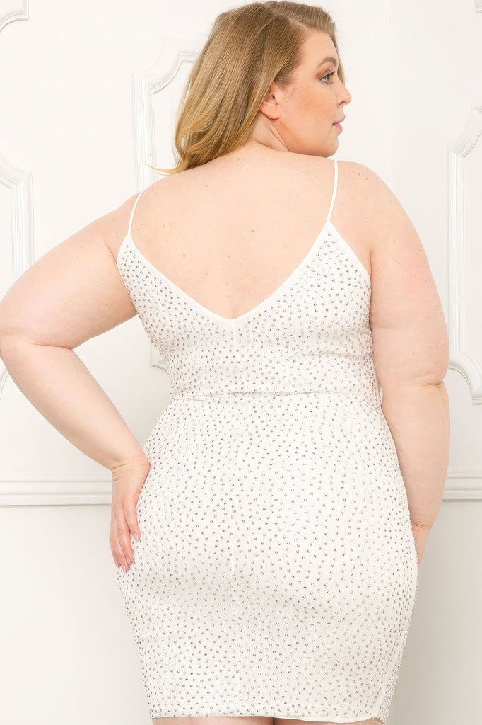 Model wearing white plus size mini dress with rhinestone detail back view
