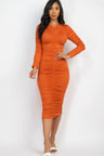 model wearing orange Long Sleeve Ruched Midi Dress