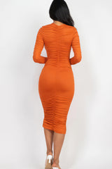 back view of model wearing orange Long Sleeve Ruched Midi Dress