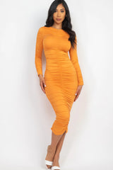 model wearing yellow orange Long Sleeve Ruched Midi Dress