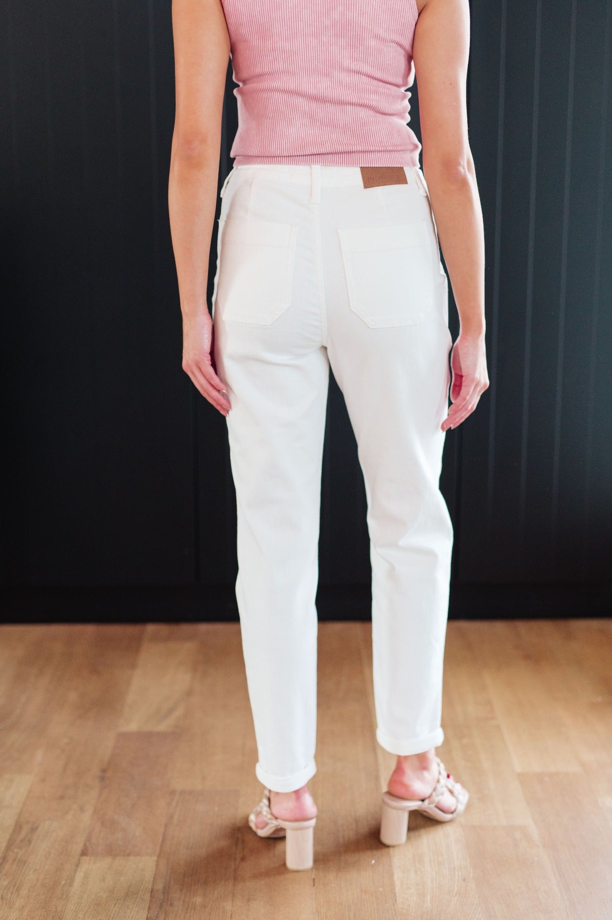 back view of model wearing Classic High Rise Judy Blue Joggers in Off White with pink tank top