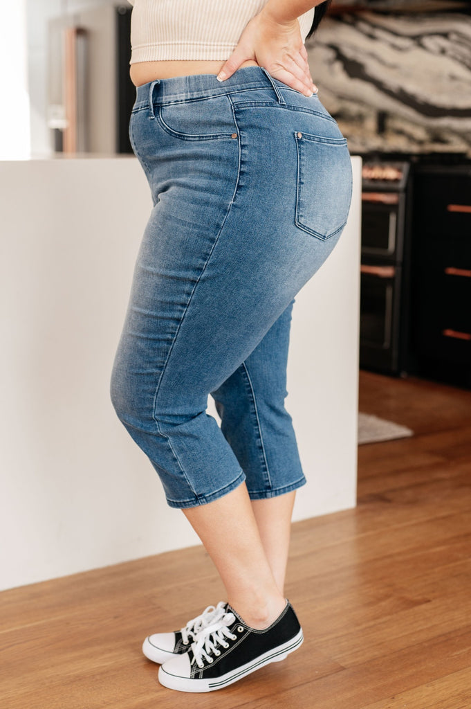 side view of plus size medium wash judy blue High Rise Pull On Capri Jeans
